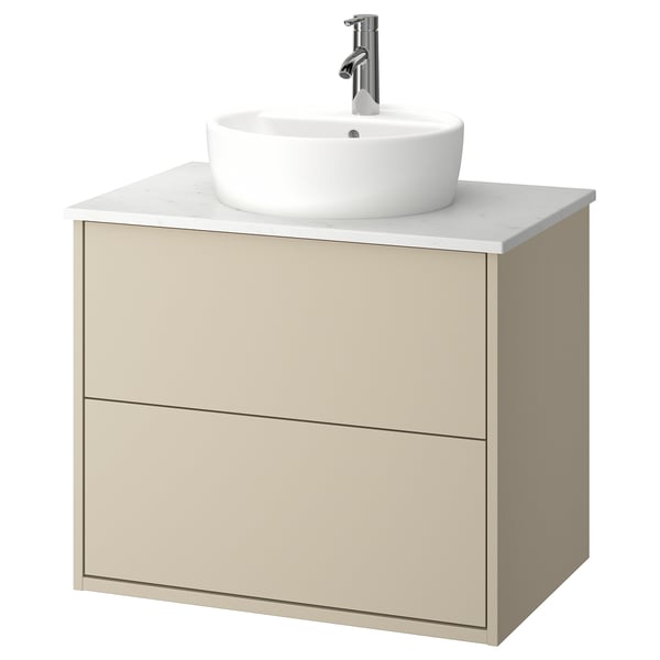 Beige wall-mounted bathroom cabinet with round white sink & chrome tap.