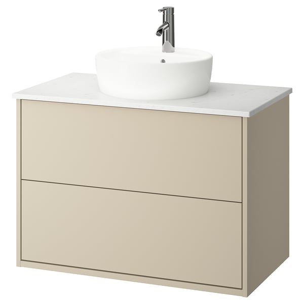 HAVBÄCK beige bathroom vanity. Round marble sink, chrome tap, wall-mounted drawers, modern design.
