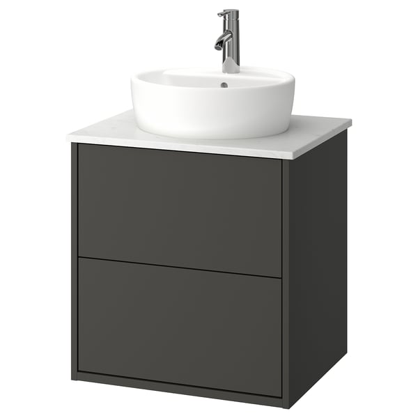 Black bathroom vanity with round white sink and chrome tap.