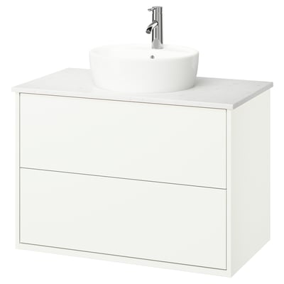 Modern white bathroom vanity with round basin & chrome tap.