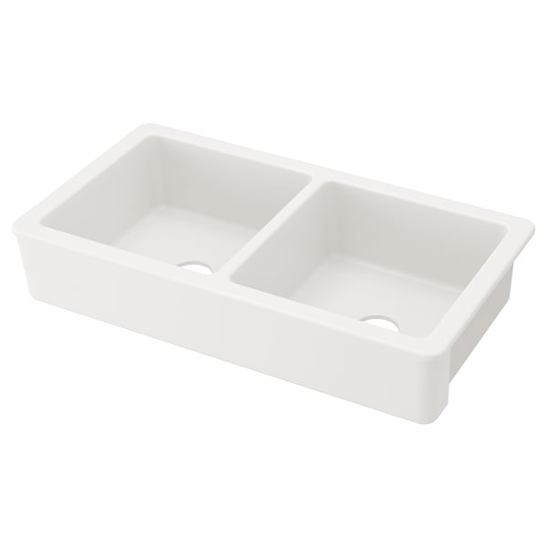 A white double basin sink, named HAVSEN, with soft rounded corners and a 25-year guarantee. Ideal for comfortable dishwashing.