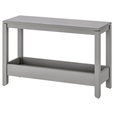 A grey HAVSTA console table made of solid pine with a single storage shelf. Its design is simple and rustic, suitable for narrow spaces.