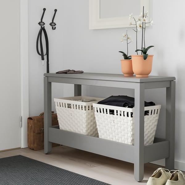 Grey HAVSTA console table with baskets, plants.
