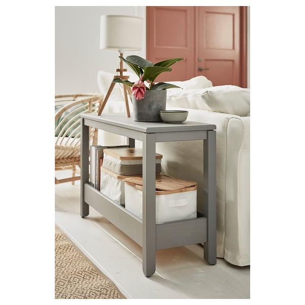 HAVSTA console table behind sofa, grey, wood & metal, lamp, plant, storage boxes.