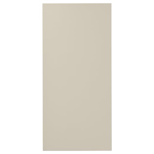 A beige HAVSTORP kitchen cabinet door with a smooth, rectangular design made from acrylic paint and fiberboard.