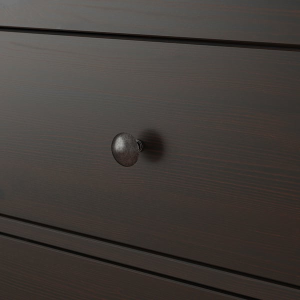 Dark wood chest drawer with sleek round metal handle, showcasing high-quality finish and craftsmanship.