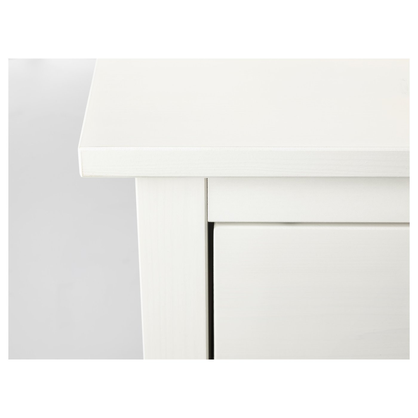 White wooden chest with smooth drawers, designed for home use.