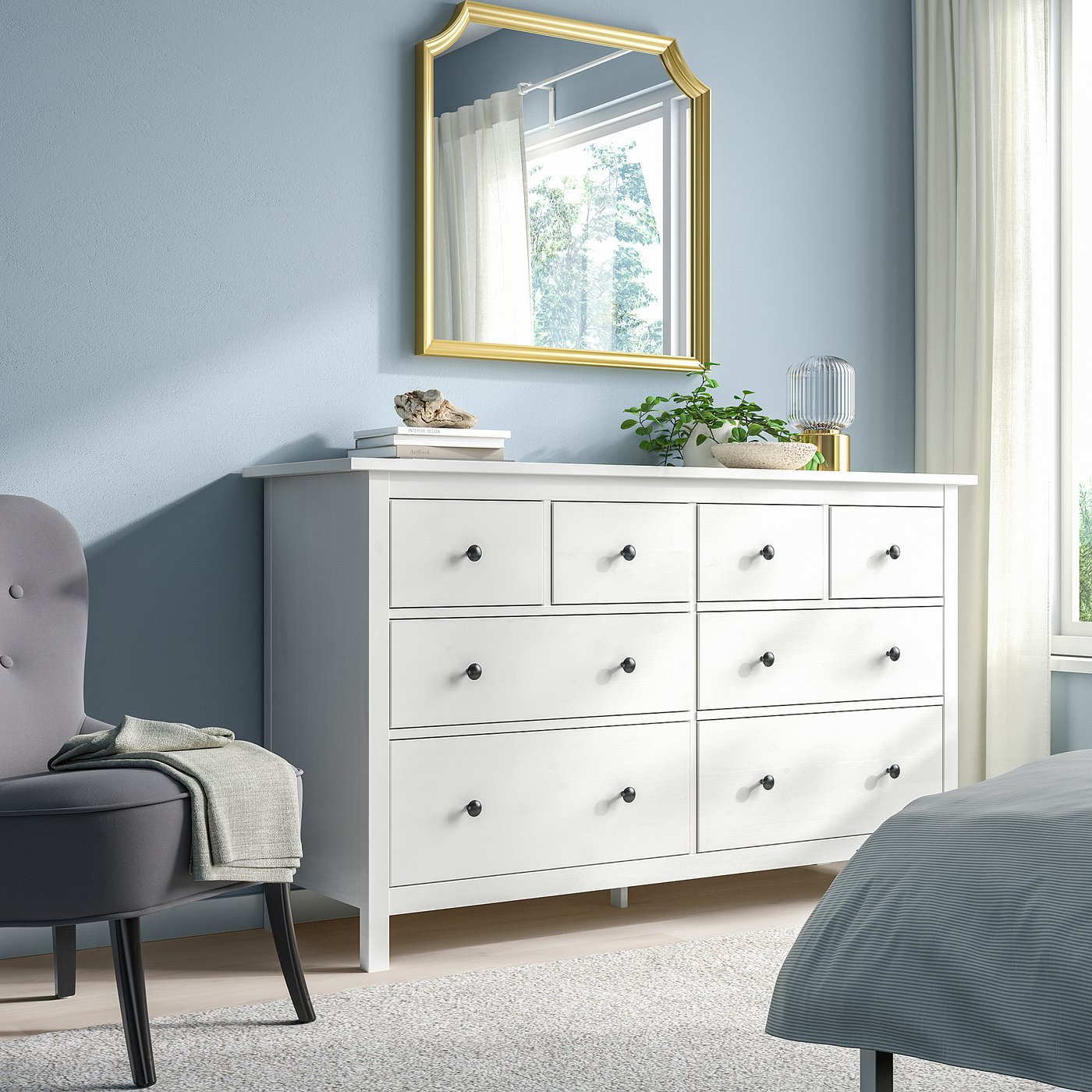 HEMNES chest with 6 drawers, gold mirror, chair, plant, bed.
