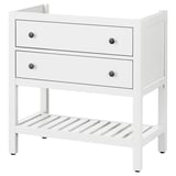 A white HEMNES dresser, featuring two drawers with black knobs and an open shelf, crafted from pine wood.