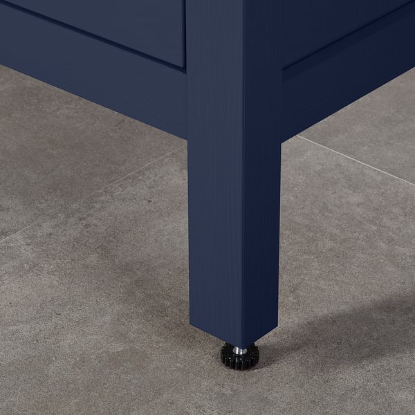 Dark blue wooden drawer unit with smooth, soft-close drawers and adjustable feet for stability.