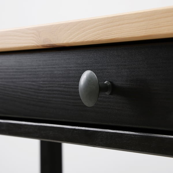 Simple wooden desk with sleek black handle, showcasing quality craftsmanship and clean design.