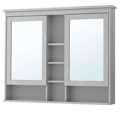 A grey HEMNES mirror cabinet with glass doors and shelves, designed for bathroom storage.