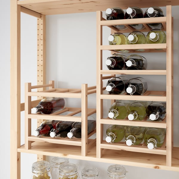 Wooden storage rack holding 9 wine bottles, with space for expansion.