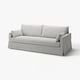 Modern light grey sofa with clean lines; soft cushions; reversible back; upholstered in cotton-polyester blend.