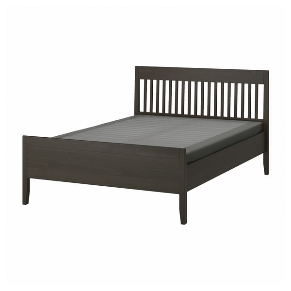 Modern dark wooden IDANÄS bed with sleek spindle headboard and grey mattress.