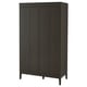 A tall, dark brown IDANÄS wardrobe with bifold doors, standing on four legs. It offers modern and timeless storage with adjustable shelves.