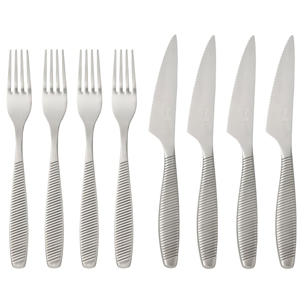 IKEA 365+ cutlery set with stainless steel forks and serrated knives. Modern design with ribbed handles for grip. Eight pieces, clean and functional.