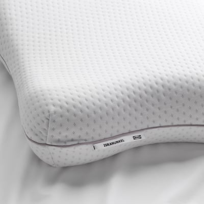 Close-up of ergonomic pillow with soft memory foam and butterfly design for comfortable support in any sleeping position.