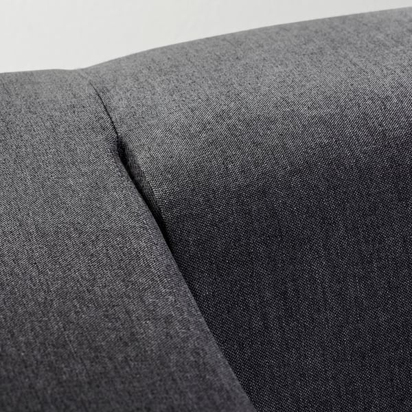 A close-up of a grey sofa, highlighting its smooth, durable, and two-tone fabric texture. The stitching and material quality are evident.