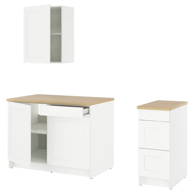 White KNOXHULT kitchen set with wood top, cabinets, drawers, counter.