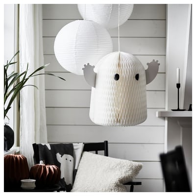 Ghost-shaped lantern hangs from ceiling, surrounded by smaller lanterns, creating festive halloween atmosphere.