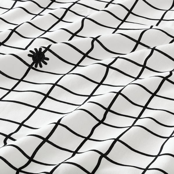 Black spider web print on white tablecloth, high-quality cotton.