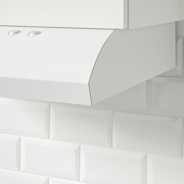 White kitchen hood installed inside a cabinet with led lighting and front control panel.