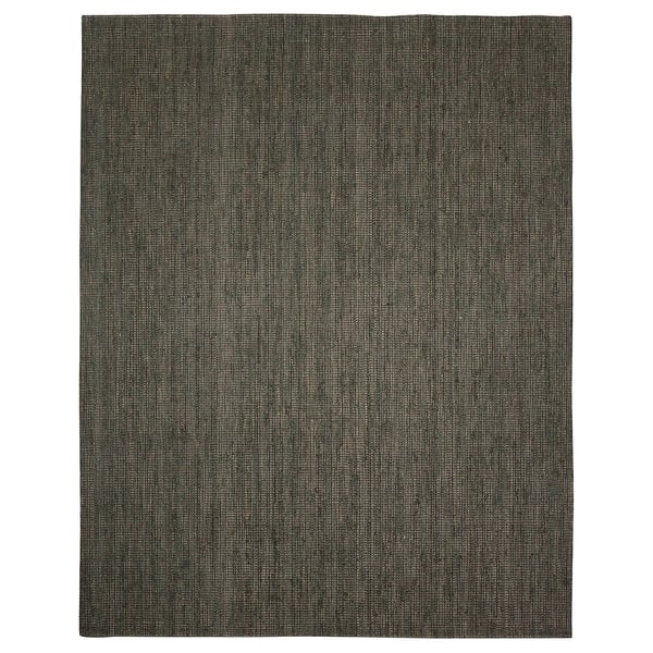 A dark green LANDBANA jute rug with a natural, flat-woven texture.