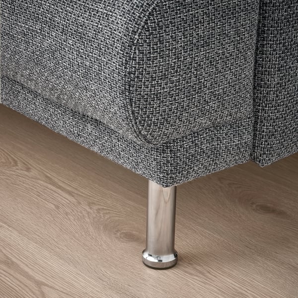 Modern sofa leg close-up, chrome-plated steel, sleek design, sturdy construction.