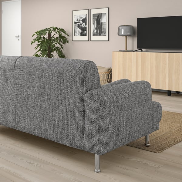 Grey LÅNGARYD sofa in living room with modern design, tv, plant, and photos.