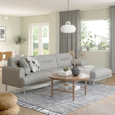 Modern living room with LÅNGARYD sofa, coffee table, & large window.