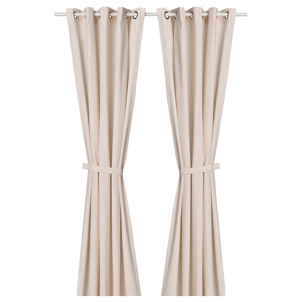 Beige curtains with specks, metal eyelets, tiebacks. Modern window design.