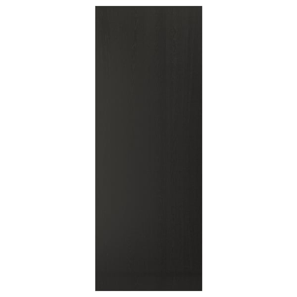 A black LERHYTTAN kitchen cabinet door with a traditional style and bevelled edges made from ash veneer.