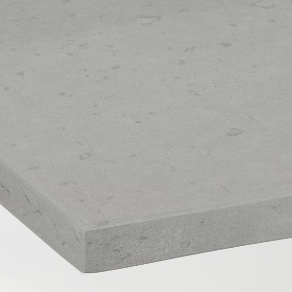 Smooth, speckled grey recycled glass countertop, finely textured, shows subtle natural variations.