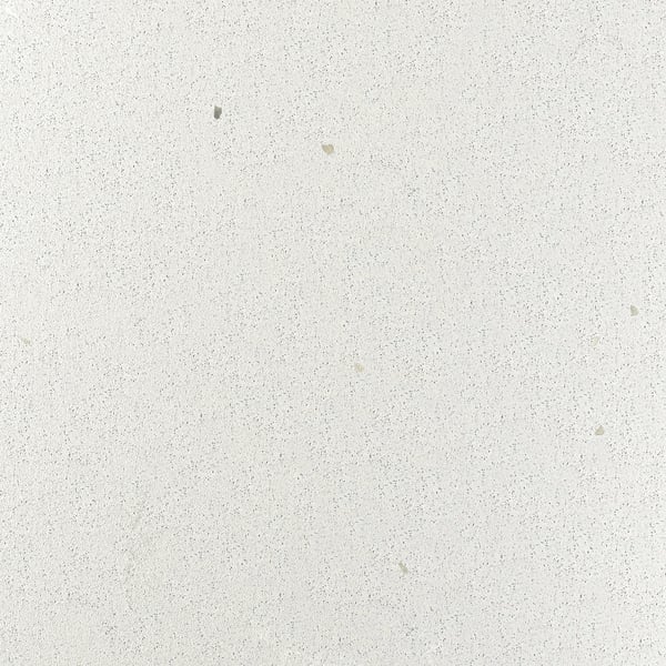 Smooth, speckled white worktop with slight blemishes, showcasing recycled glass texture.