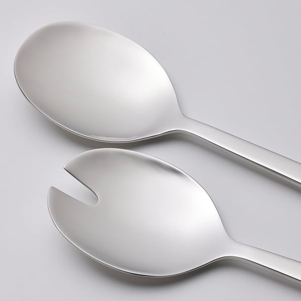 Polished stainless steel spoon and fork, sleek contemporary design.