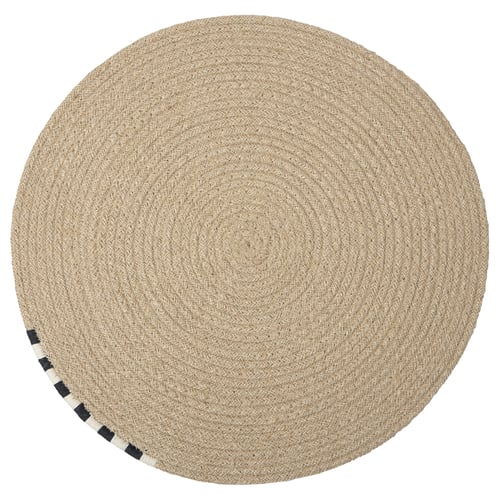 Round, natural jute MÄVINN place mat with black & white border.