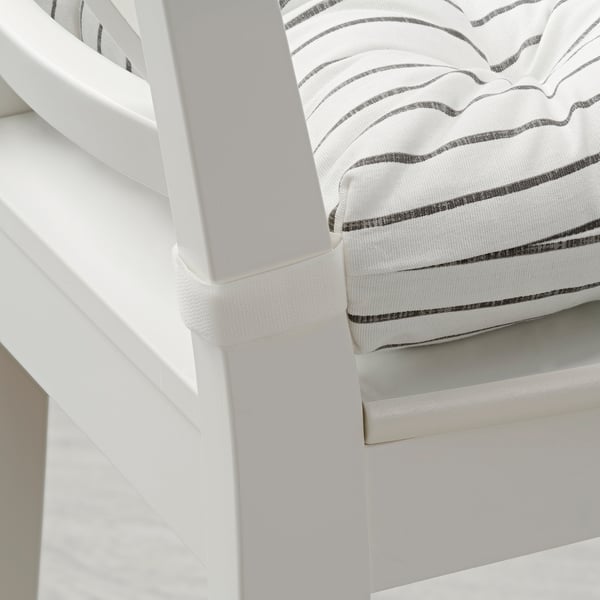 Close-up of striped chair pad in white and grey, highlighting thick cushioning and clean fabric.