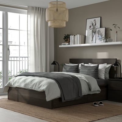 Modern bedroom with grey MALM bed, wooden nightstands, hanging light, window with curtains, and wall shelf. Bed is centred, large.