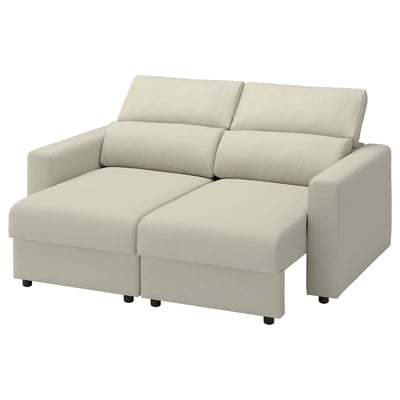 Beige sofa with adjustable headrests and extendable chaise sections, simple design.