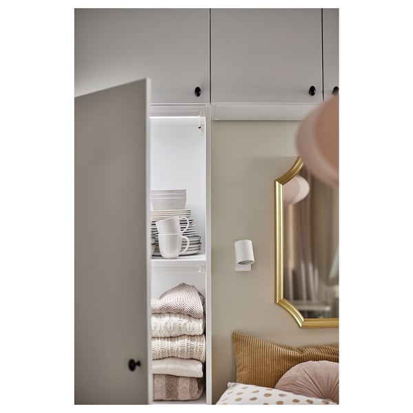 Closet with organised clothes, dishes, led light, and gold mirror