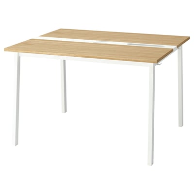 A MITTZON conference table with a light wood top and white legs, featuring cable management.