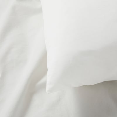 Clean white pillowcase displayed, showing smooth, crisp texture.