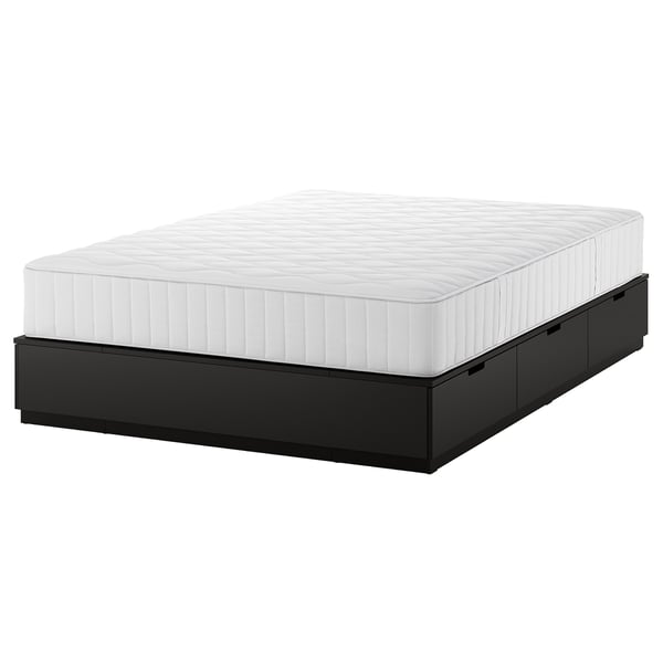A NORDLI bed frame with integrated storage drawers. It is white with a sleek, modern design, combining functionality and style.