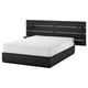 Black modern bed with white mattress, integrated led lights, 6 drawers, sleek design.