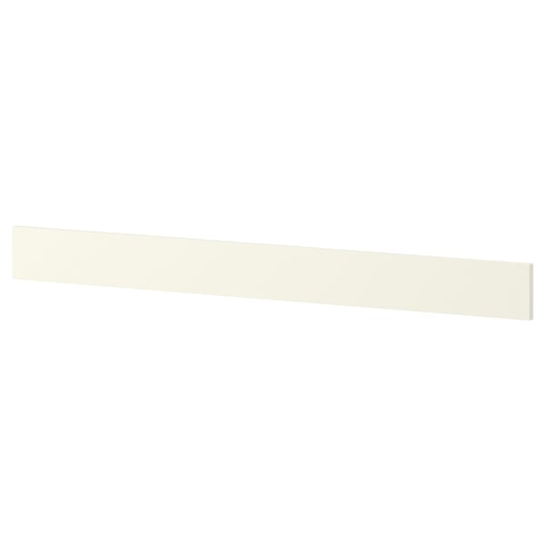 A white ikea NYTTIG hob separator. Its a slim, rectangular piece designed to protect the hob and organize utensils.