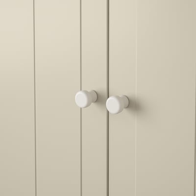 Double door knobs, sleek and modern design. White coating, securely attached. Ideal for contemporary décor.
