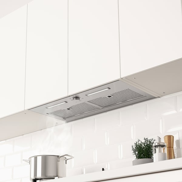 Built-in range hood with led light, mounted above stove in modern kitchen.