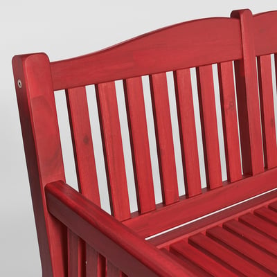Red wooden bench backrest shown, featuring vertical slats and sturdy design.