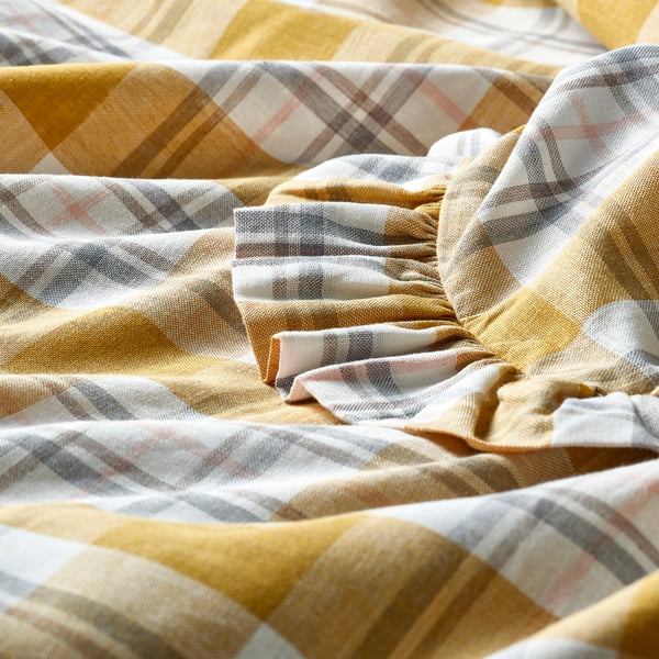 Close-up of high-quality plaid cotton pillowcase with neat frill edges, showcasing its soft texture and intricate pattern.